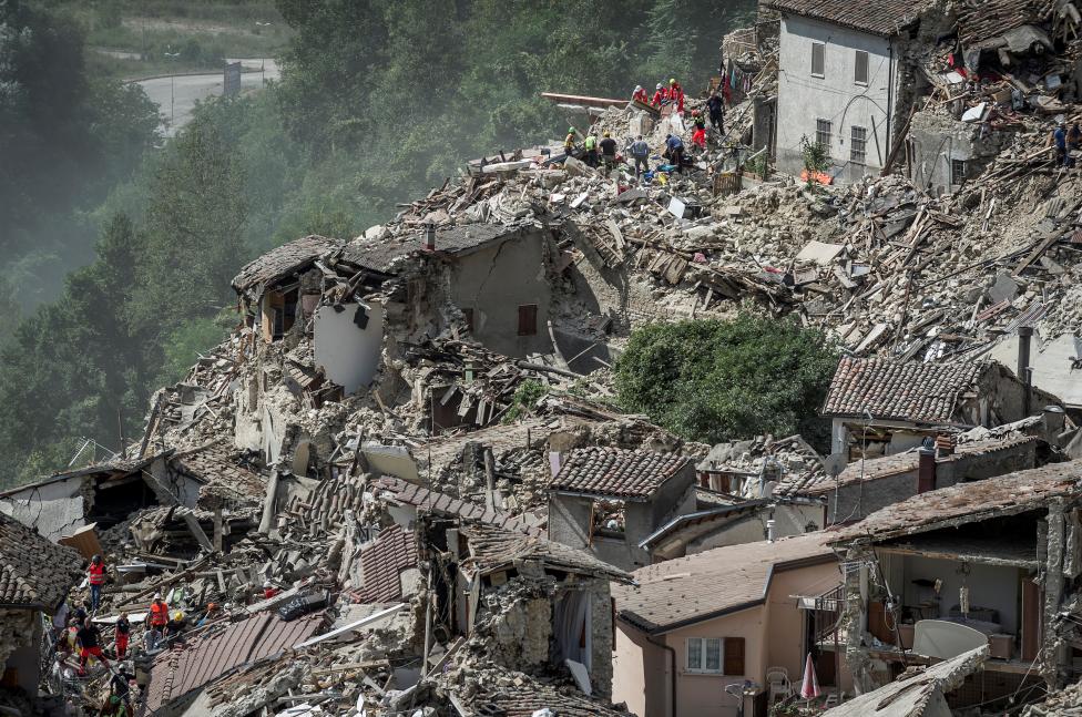 Rescuers work following an earthquake in Pescara del Tronto, central Italy. REUTERS/Adamo Di Loreto