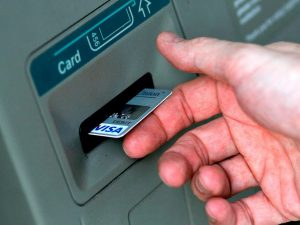 A man puts a card into an ATM in North Carolina last year. A recent study found that nearly a third of American consumers have reported credit card fraud in the past five years.